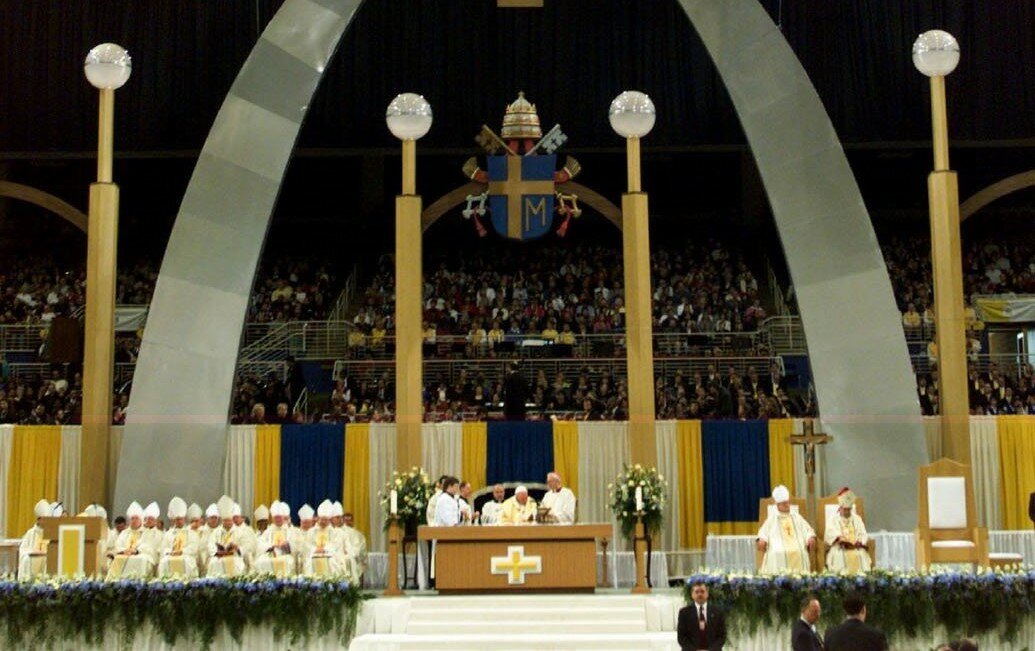 Pope John Paul II celebrates Mass Jan. 27, 1999, in the Trans World Dome under an arch built to resemble the Gateway Arch in St. Louis.
